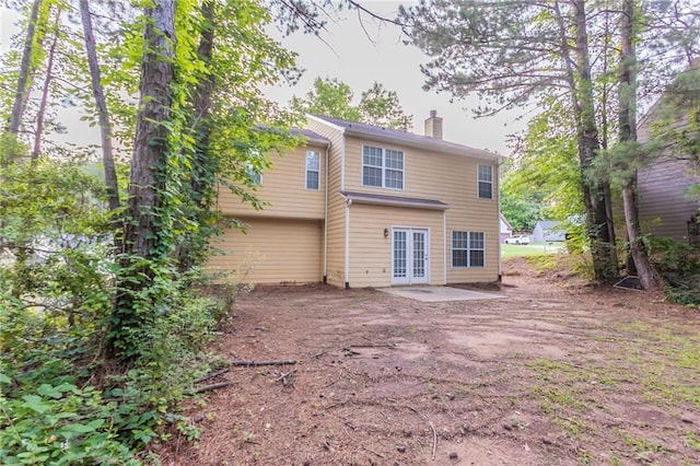 7113 Ambercrest Ct, Austell, GA 30168 - rear view of property with french doors, a chimney, and a patio