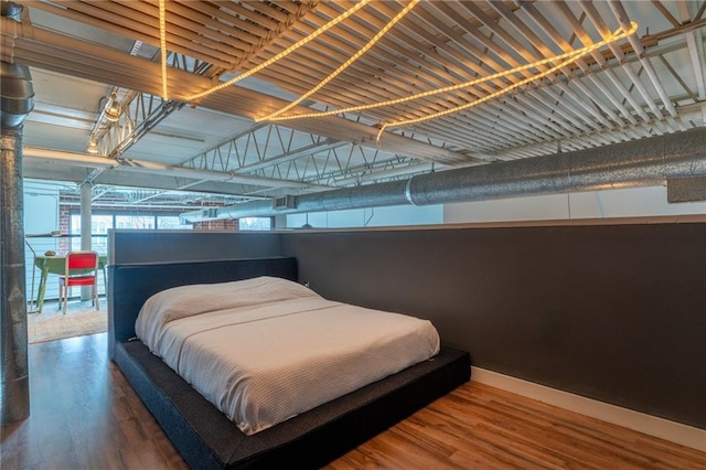 bedroom featuring wood finished floors