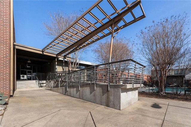 exterior space with fence and a pergola