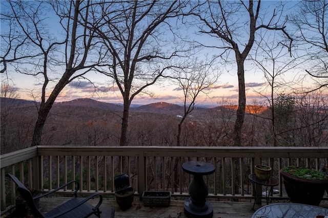 deck at dusk with a mountain view