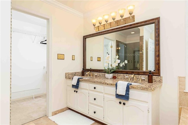 full bathroom featuring crown molding, a stall shower, a spacious closet, double vanity, and tile patterned floors