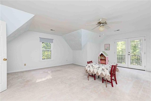 bonus room featuring carpet flooring, french doors, vaulted ceiling, ceiling fan, and baseboards