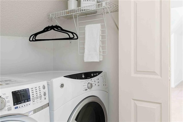 laundry room with separate washer and dryer