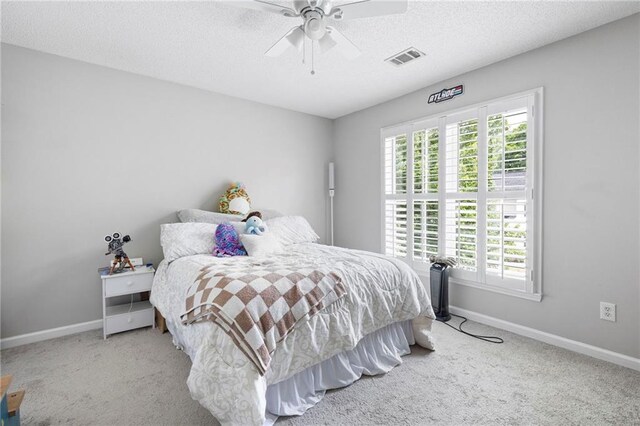 212 Regent Sq, Woodstock, GA 30188 - carpeted bedroom featuring baseboards, a ceiling fan, a textured ceiling, and visible vents