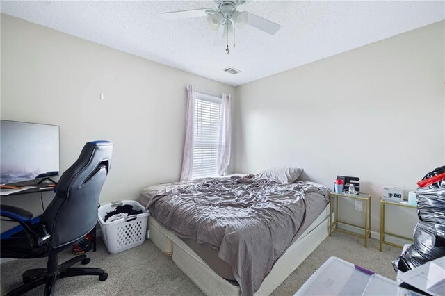 212 Regent Sq, Woodstock, GA 30188 - bedroom with carpet, a ceiling fan, a textured ceiling, and visible vents
