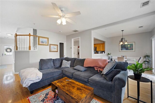 212 Regent Sq, Woodstock, GA 30188 - living area featuring baseboards, visible vents, and light wood-type flooring