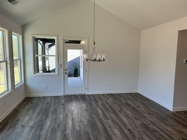 unfurnished dining area featuring visible vents, a chandelier, dark wood finished floors, and vaulted ceiling