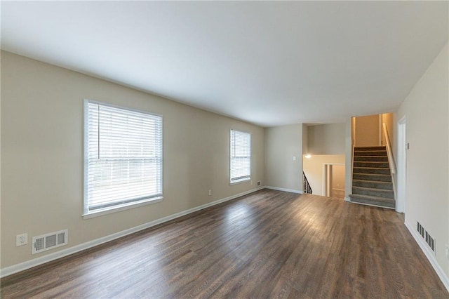 3390 Glenview Cir SW, Atlanta, GA 30331 - unfurnished living room with dark wood-type flooring and stairway