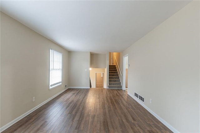 3390 Glenview Cir SW, Atlanta, GA 30331 - unfurnished living room with dark wood-style floors and stairway