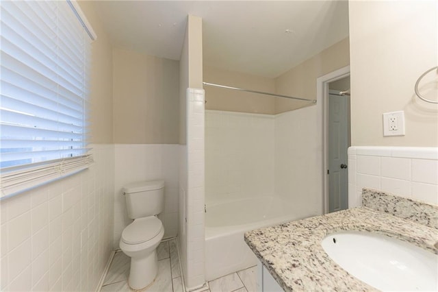 3390 Glenview Cir SW, Atlanta, GA 30331 - full bathroom featuring tile walls, vanity, bathtub / shower combination, and a wainscoted wall