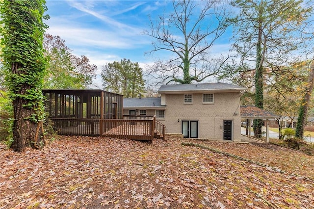 3390 Glenview Cir SW, Atlanta, GA 30331 - back of house with a sunroom, brick siding, and a deck
