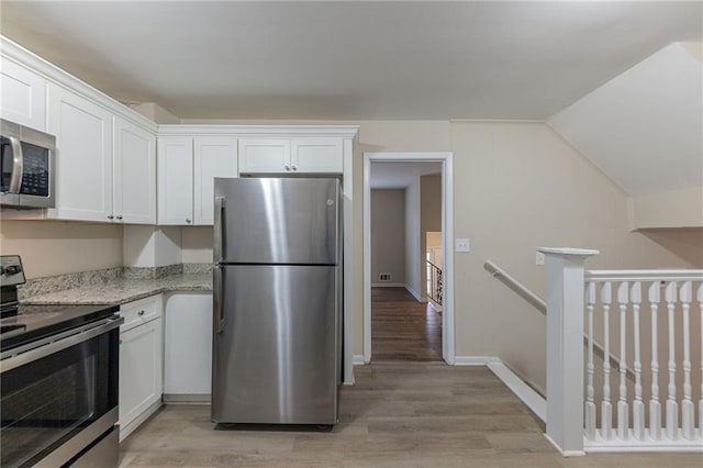 3390 Glenview Cir SW, Atlanta, GA 30331 - kitchen featuring appliances with stainless steel finishes, white cabinetry, and light wood-style flooring