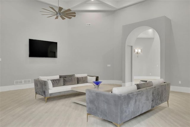 living room featuring ceiling fan and light hardwood / wood-style floors