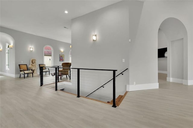 hallway with light hardwood / wood-style flooring