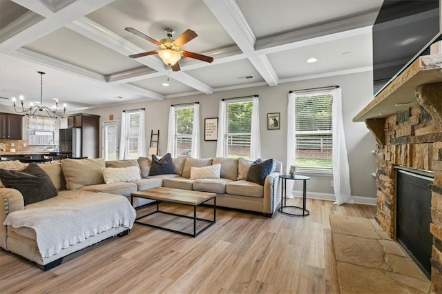 4275 Hunters Walk Way, Cumming, GA 30028 - living room with light wood finished floors, a fireplace, coffered ceiling, a ceiling fan, and a chandelier