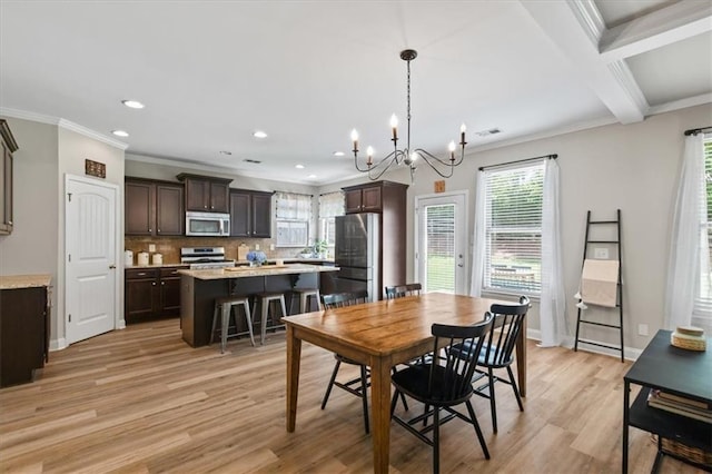 4275 Hunters Walk Way, Cumming, GA 30028 - dining space with light wood finished floors, a chandelier, plenty of natural light, recessed lighting, and crown molding