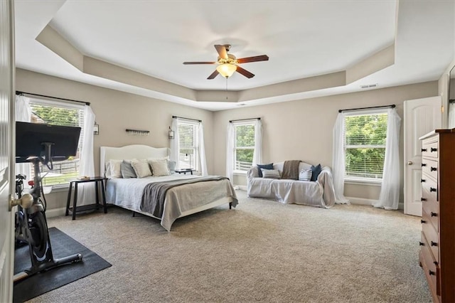 4275 Hunters Walk Way, Cumming, GA 30028 - carpeted bedroom featuring a raised ceiling and a ceiling fan