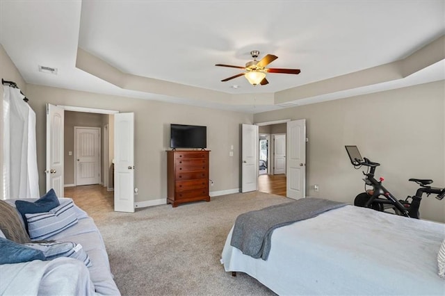4275 Hunters Walk Way, Cumming, GA 30028 - bedroom featuring light colored carpet, a tray ceiling, and ceiling fan