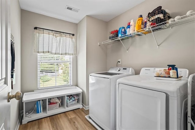 4275 Hunters Walk Way, Cumming, GA 30028 - laundry area with independent washer and dryer and light wood-style floors
