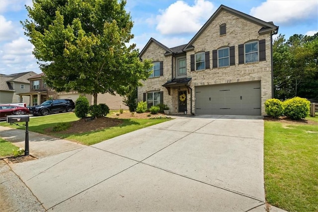 4275 Hunters Walk Way, Cumming, GA 30028 - view of front of house with driveway, an attached garage, a front lawn, stone siding, and brick siding