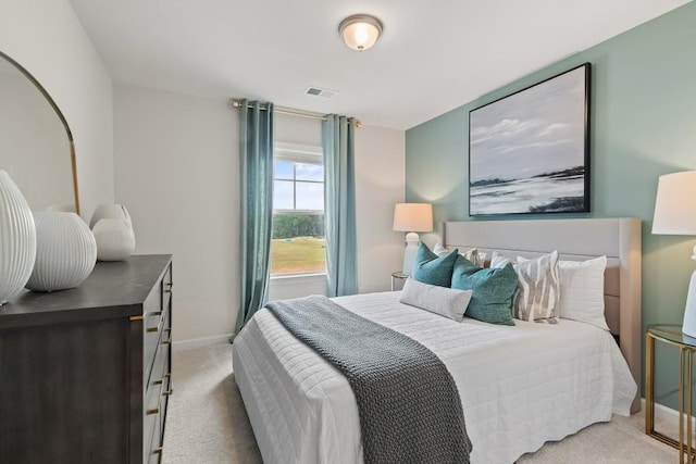 carpeted bedroom featuring baseboards