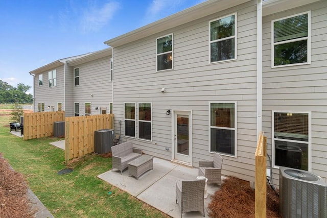 back of house with central AC and a patio