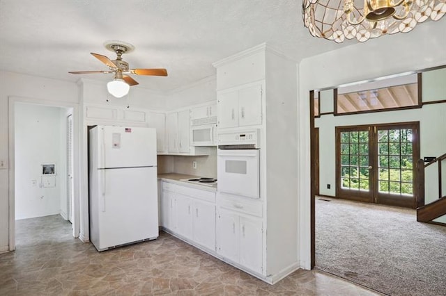 kitchen featuring white cabinetry, ceiling fan with notable chandelier, french doors, and white appliances