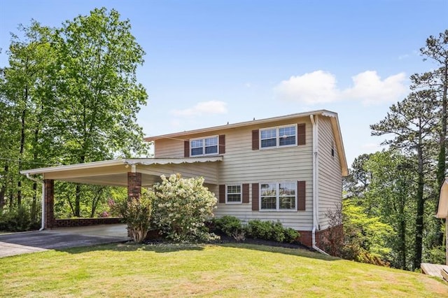 view of front facade with a front lawn and a carport