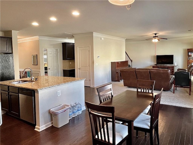 dining space featuring crown molding, a ceiling fan, dark wood-type flooring, and recessed lighting