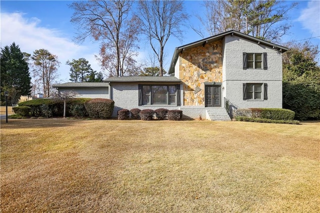 front facade with a front yard