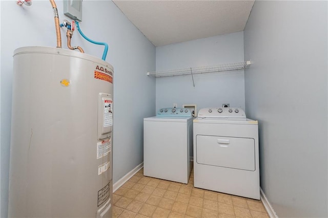 laundry area with light floors, baseboards, laundry area, separate washer and dryer, and water heater