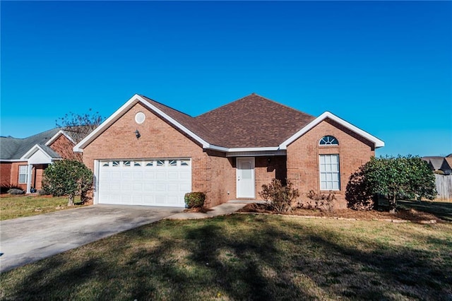 single story home with brick siding, concrete driveway, a front yard, and a garage