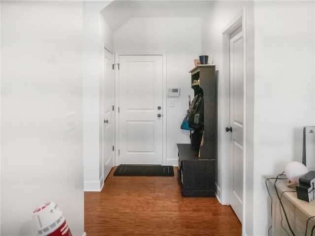 corridor with hardwood / wood-style floors