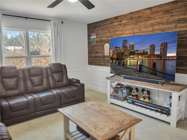 living room with light colored carpet and ceiling fan