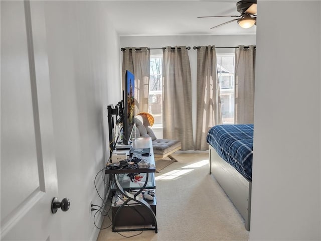 carpeted bedroom featuring ceiling fan