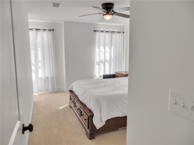 carpeted bedroom featuring ceiling fan