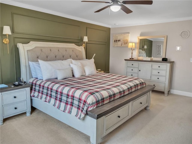 bedroom featuring ornamental molding, light carpet, and ceiling fan