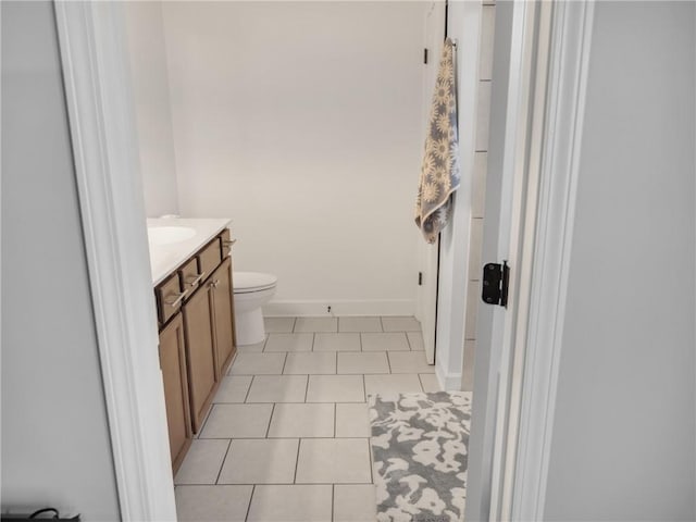 bathroom with tile patterned floors, vanity, and toilet