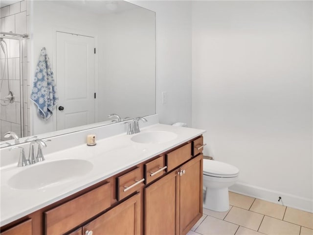 bathroom with an enclosed shower, vanity, tile patterned floors, and toilet