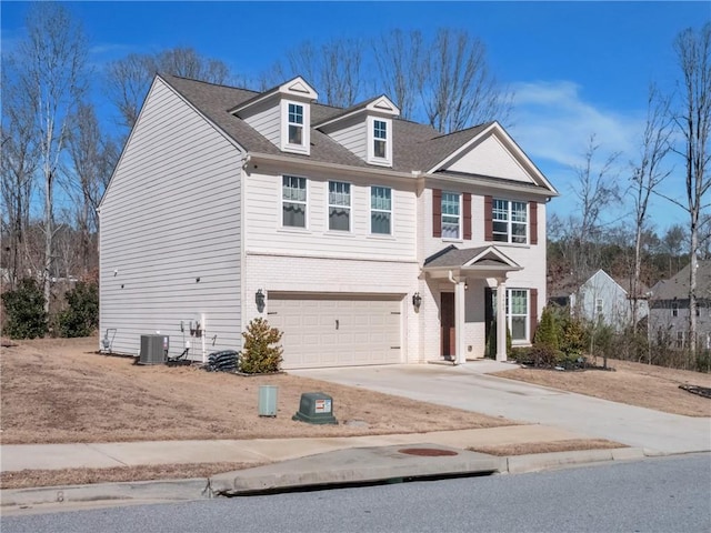 view of front of house featuring central AC unit and a garage