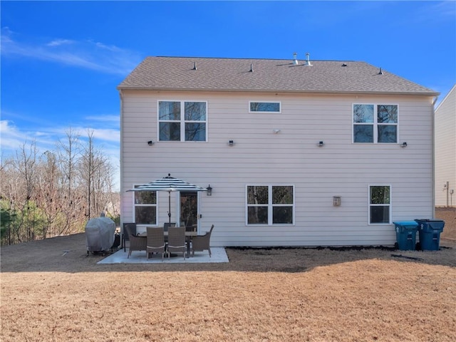 back of property featuring a patio area