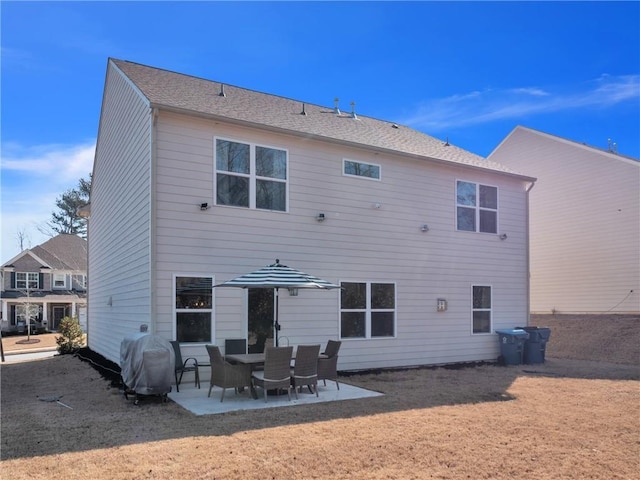 back of property featuring a patio