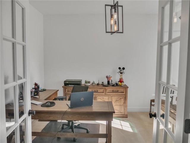 carpeted office featuring french doors