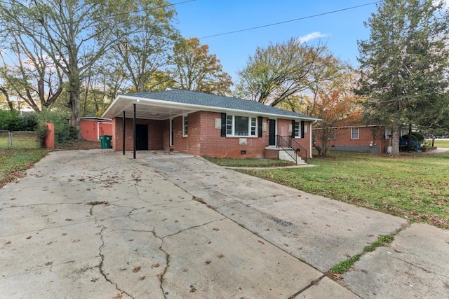 ranch-style house featuring a front yard and a carport