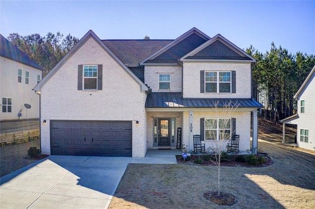 view of front of house with a porch and a garage