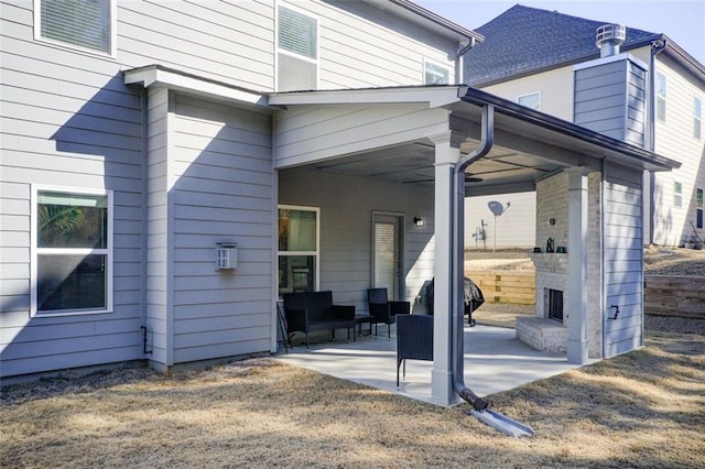 exterior space with a large fireplace