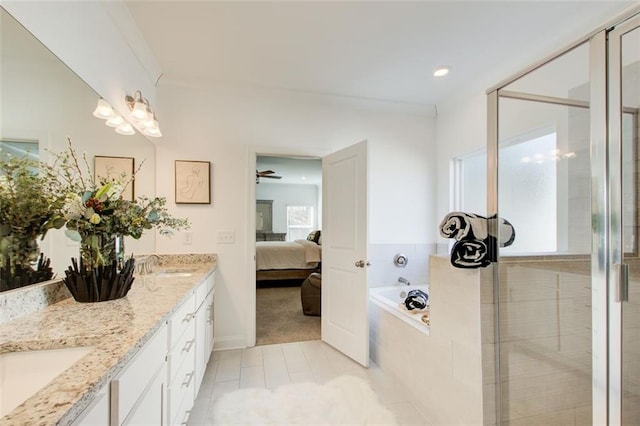 bathroom featuring vanity, shower with separate bathtub, ornamental molding, and tile patterned flooring