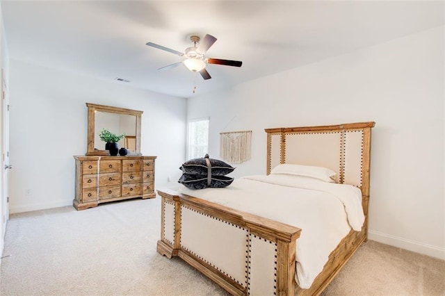 bedroom with ceiling fan and light colored carpet