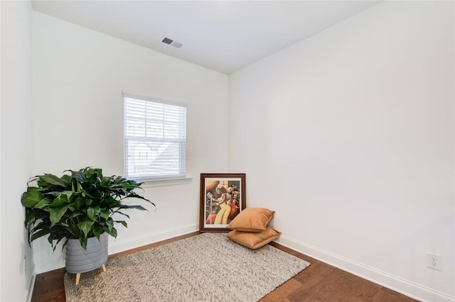 living area featuring dark wood-type flooring