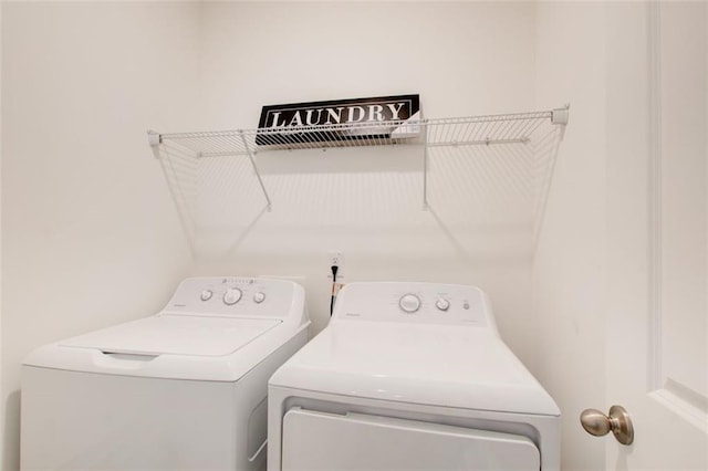 washroom with separate washer and dryer